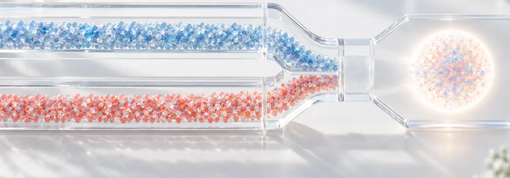 Blue and coral particles travel through separate transparent channels toward one luminous aggregate.